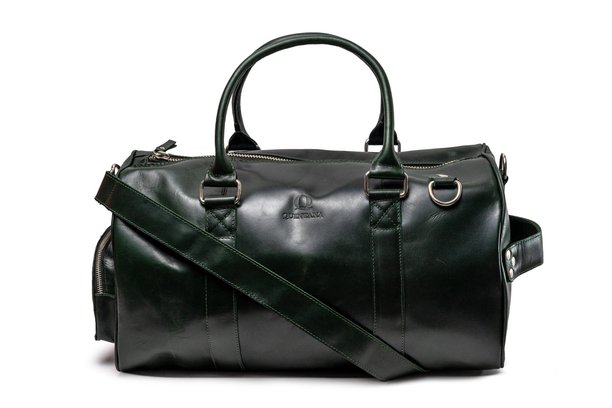 Quintana Vegetable-Tanned Leather Duffel Bag in dark green, angle with strap