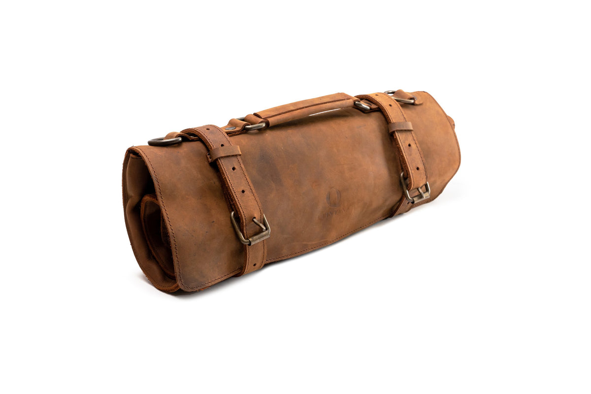 Quintana Leather Knife Roll in crazy brown, rolled three-quarter view